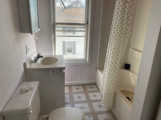 304 East Front Street Wyanet, IL 61379 - Photo 11 of 13 a bathroom with a sink toilet and shower