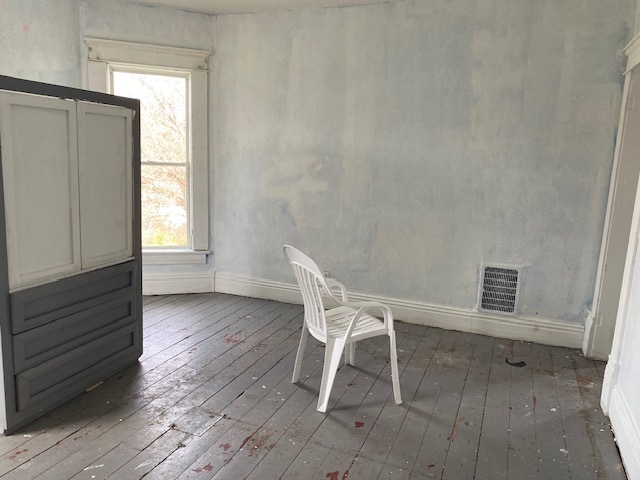 304 East Front Street Wyanet, IL 61379 - Photo 8 of 13 a chair and a table in a room