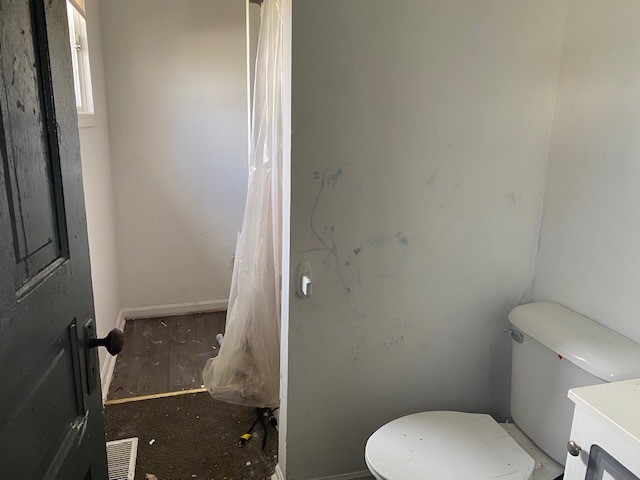 304 East Front Street Wyanet, IL 61379 - Photo 10 of 13 a bathroom with a toilet and a shower