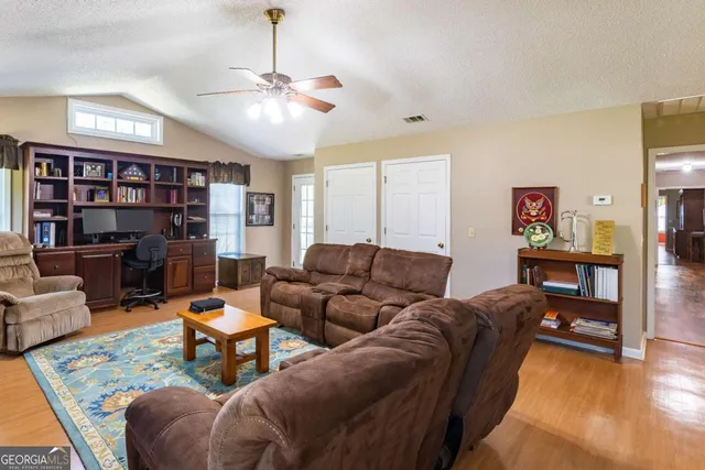 a bathroom with a sink vanity mirror and toilet