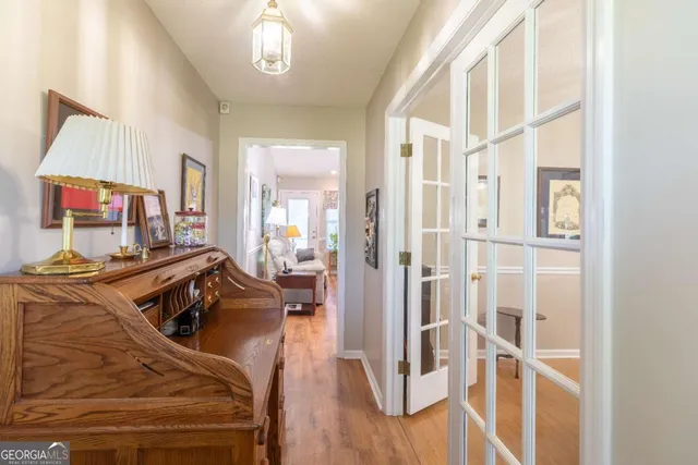 a view of a dining room with furniture and chandelier