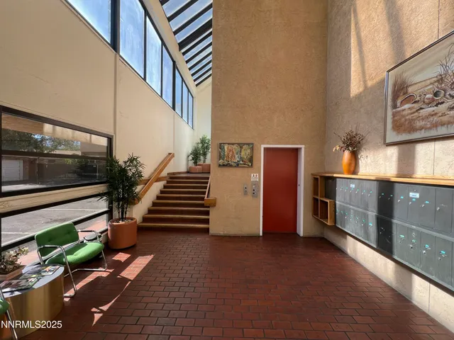 a kitchen with stainless steel appliances granite countertop a sink a stove top oven a counter space and cabinets