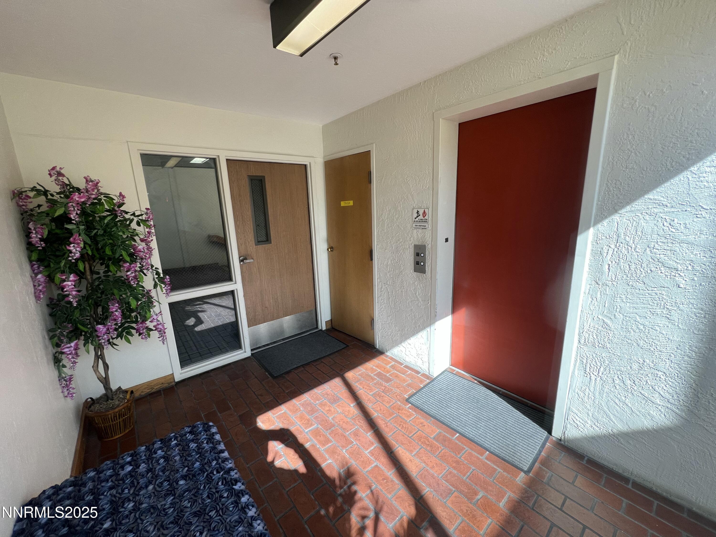 3095 Lakeside Drive, Unit 110 Reno, NV 89509 - Photo 6 of 49 a bedroom with a bed and a potted plant