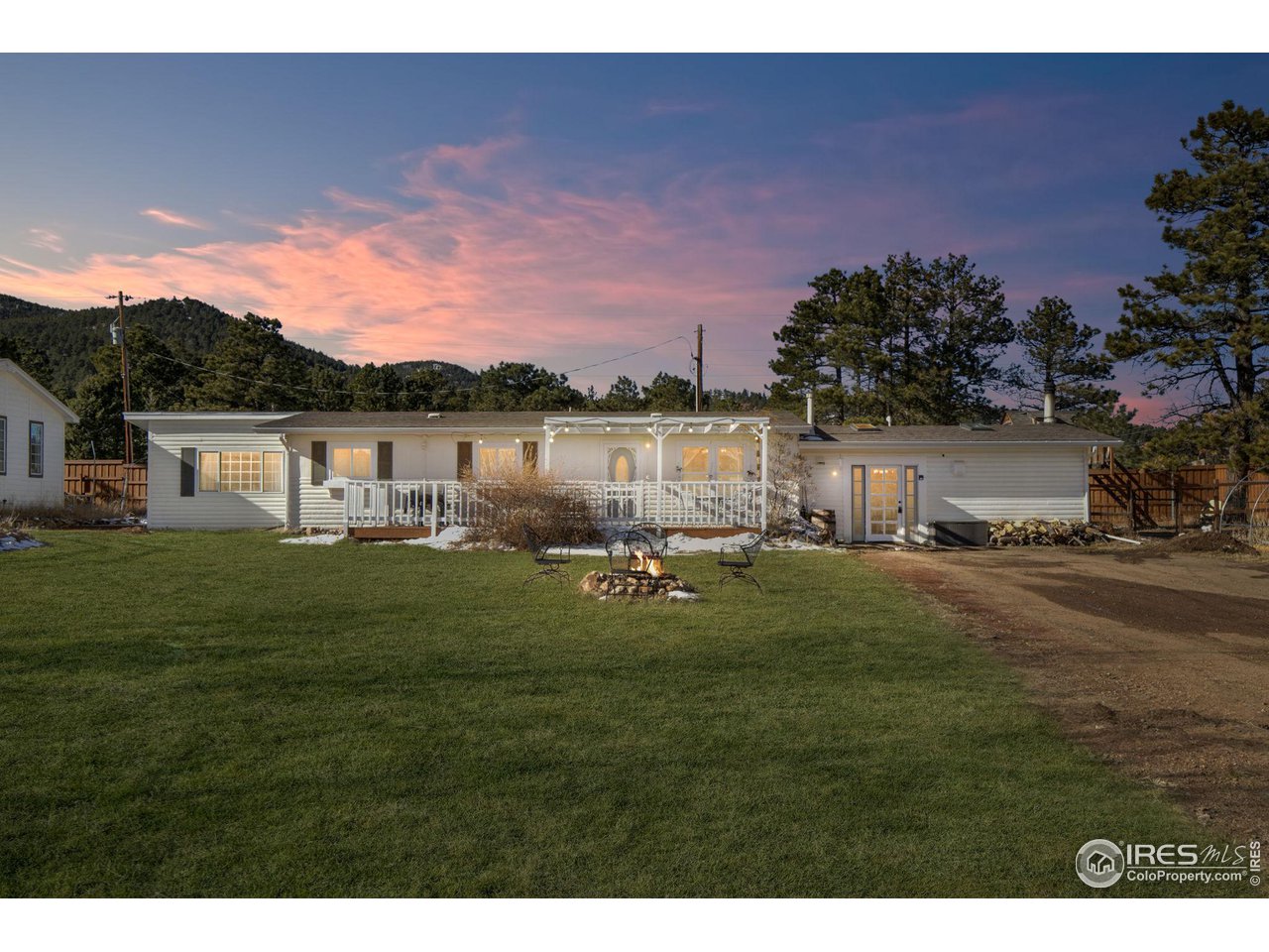 11725 Ranch Elsie Road Golden, CO 80403 - Photo 1 of 40 a swimming pool with outdoor seating and garden