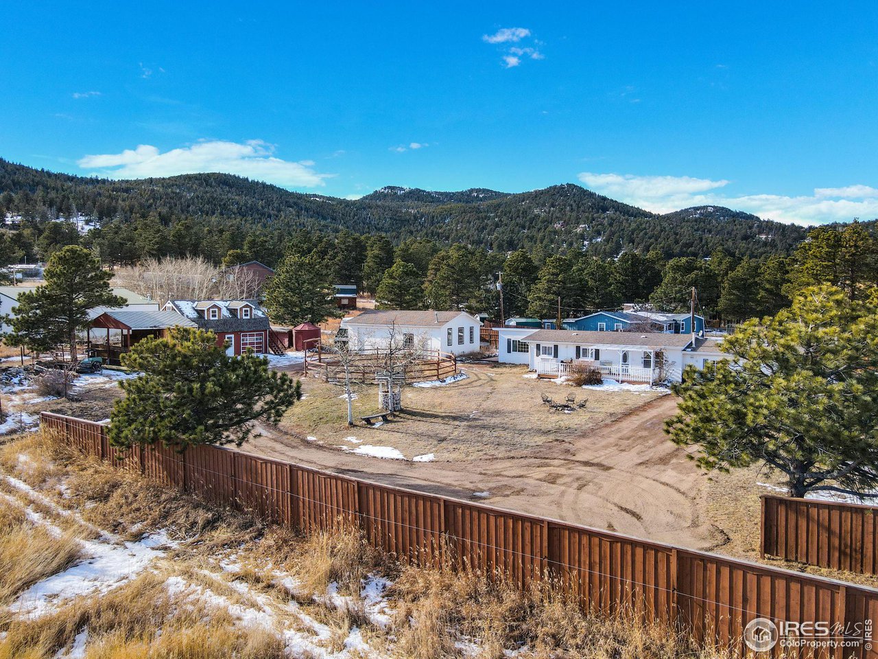 11725 Ranch Elsie Road Golden, CO 80403 - Photo 2 of 40 a view of a terrace with a garden