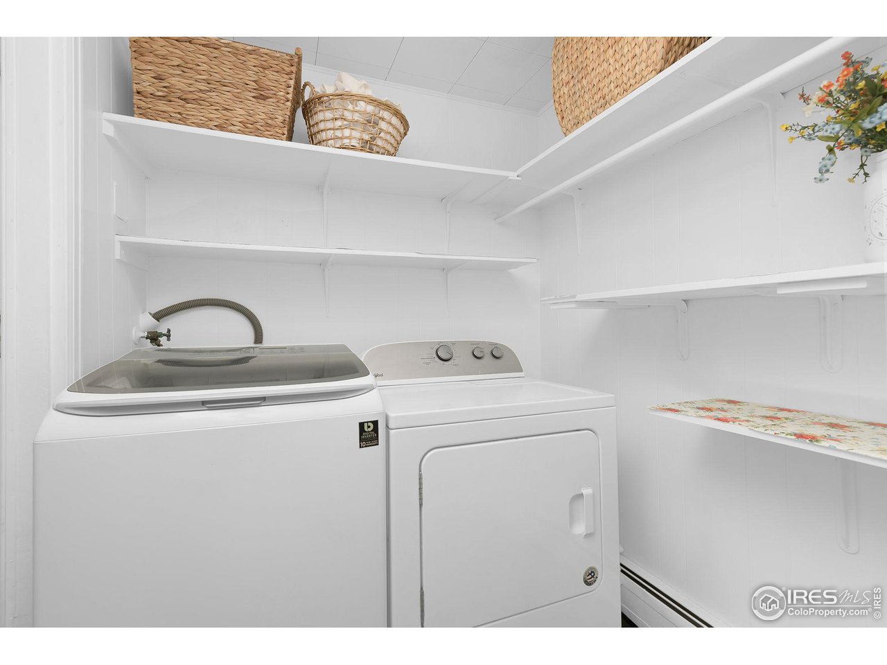 11725 Ranch Elsie Road Golden, CO 80403 - Photo 22 of 40 a utility room with dryer and washer