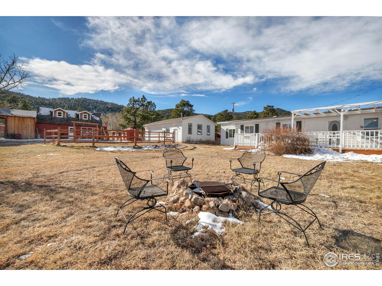 11725 Ranch Elsie Road Golden, CO 80403 - Photo 3 of 40 a view of a terrace with chairs