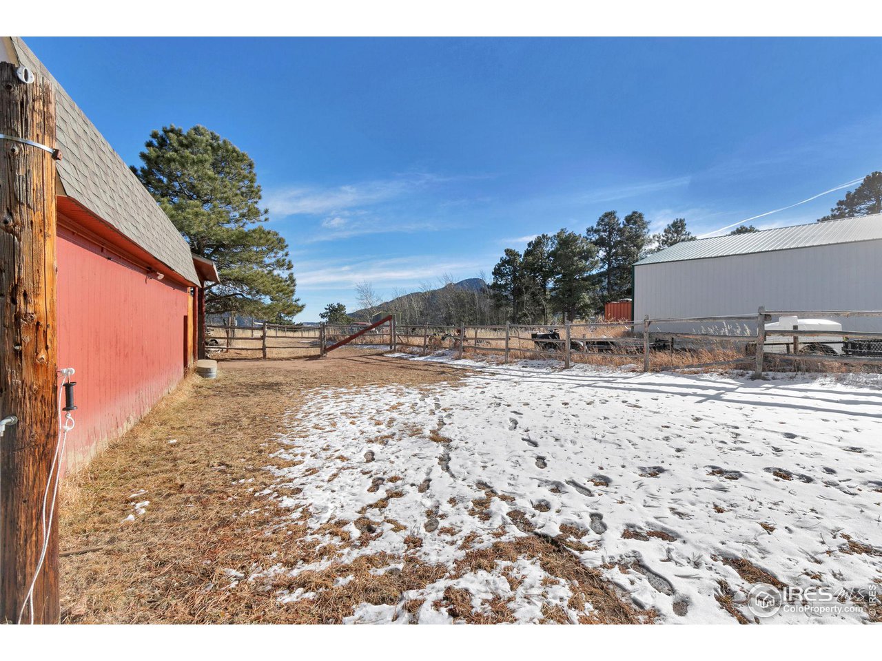 11725 Ranch Elsie Road Golden, CO 80403 - Photo 32 of 40 a view of a yard with a snow