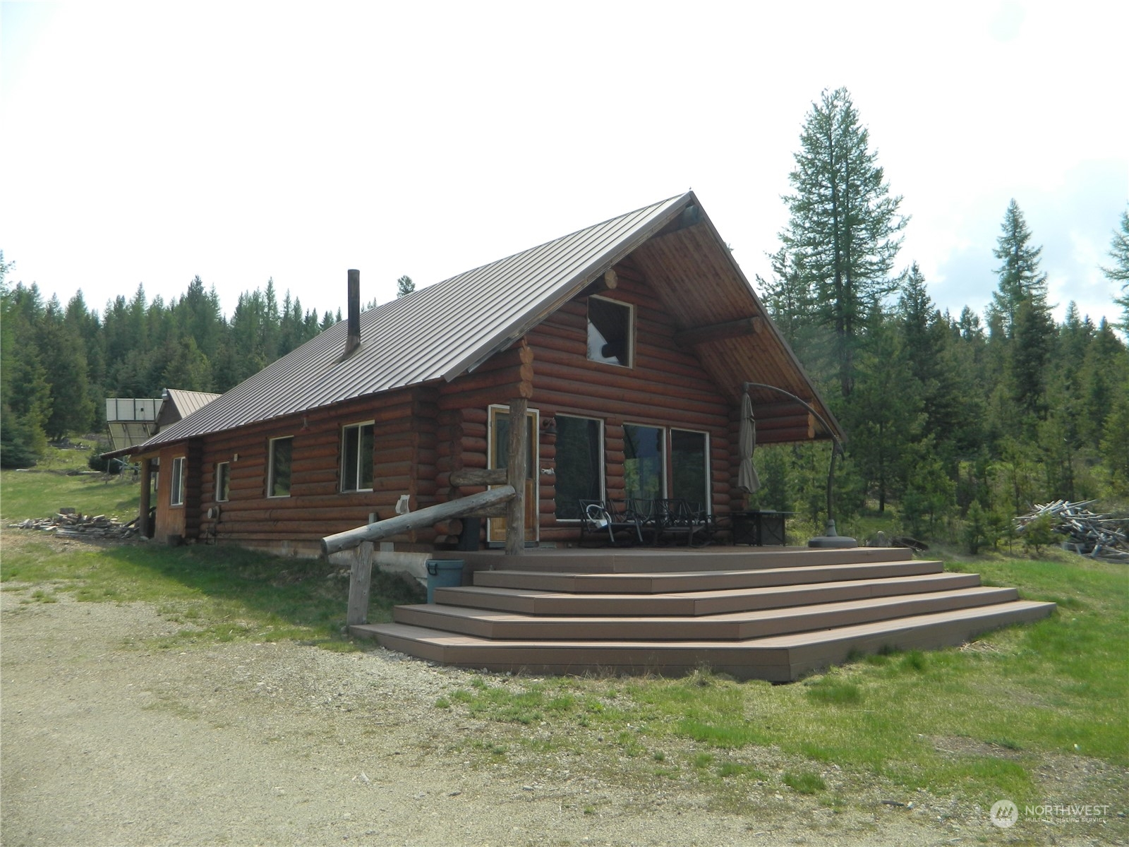 8 Fs 3200 Road Tonasket, WA 98855 - Photo 1 of 34 a front view of a house with a garden