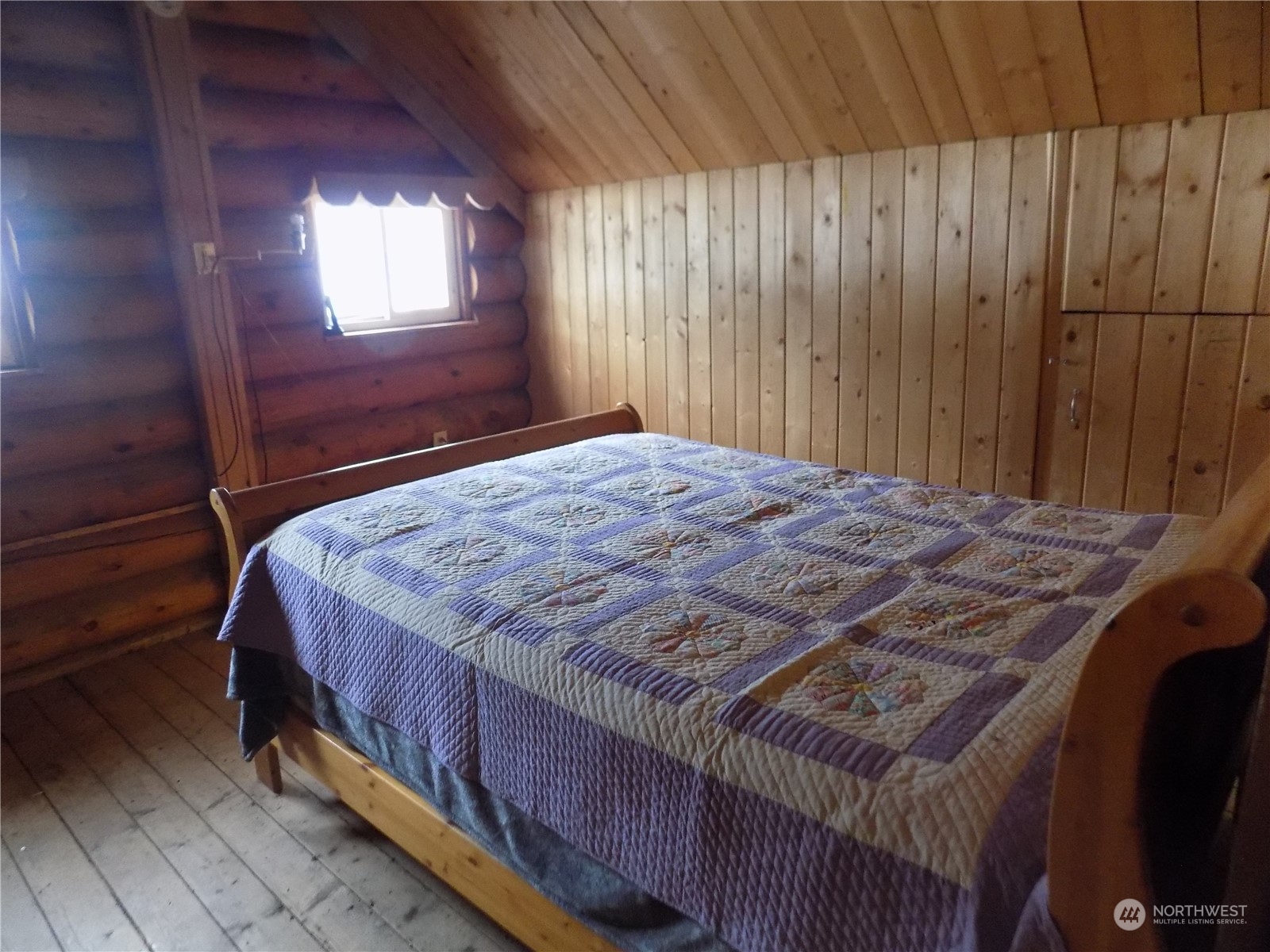 8 Fs 3200 Road Tonasket, WA 98855 - Photo 11 of 34 a bed sitting in a bedroom next to a window