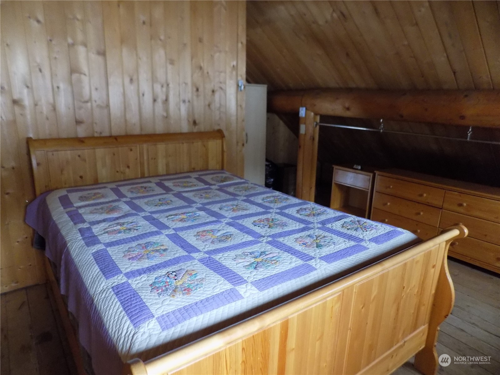 8 Fs 3200 Road Tonasket, WA 98855 - Photo 12 of 34 a bed sitting in a bedroom next to a cabinet