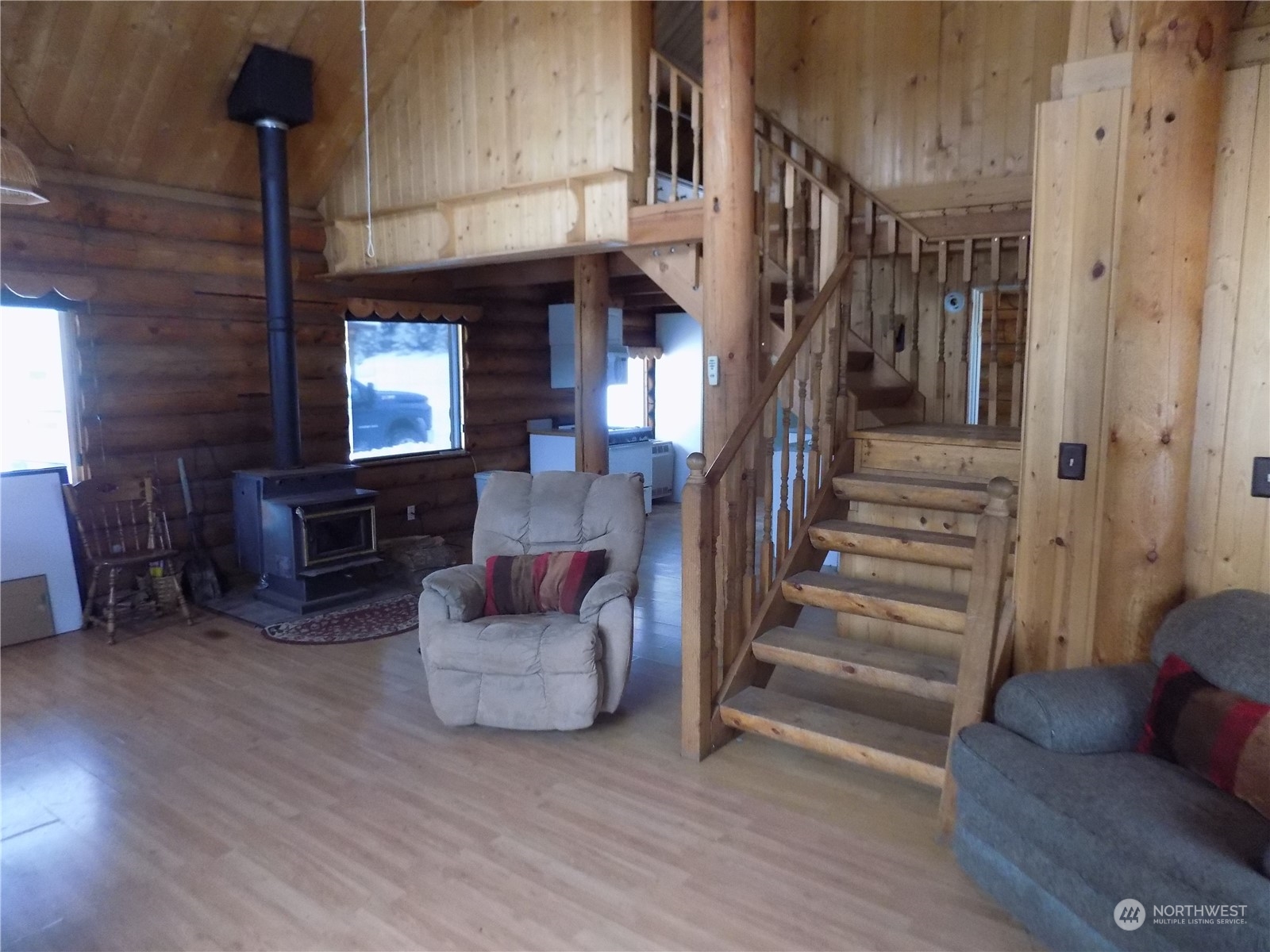 8 Fs 3200 Road Tonasket, WA 98855 - Photo 4 of 34 a living room with furniture and a fireplace