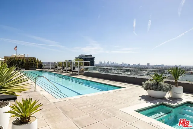 a view of a swimming pool with a lounge chairs