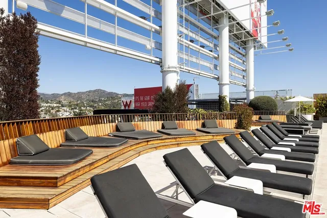 a view of swimming pool with outdoor seating