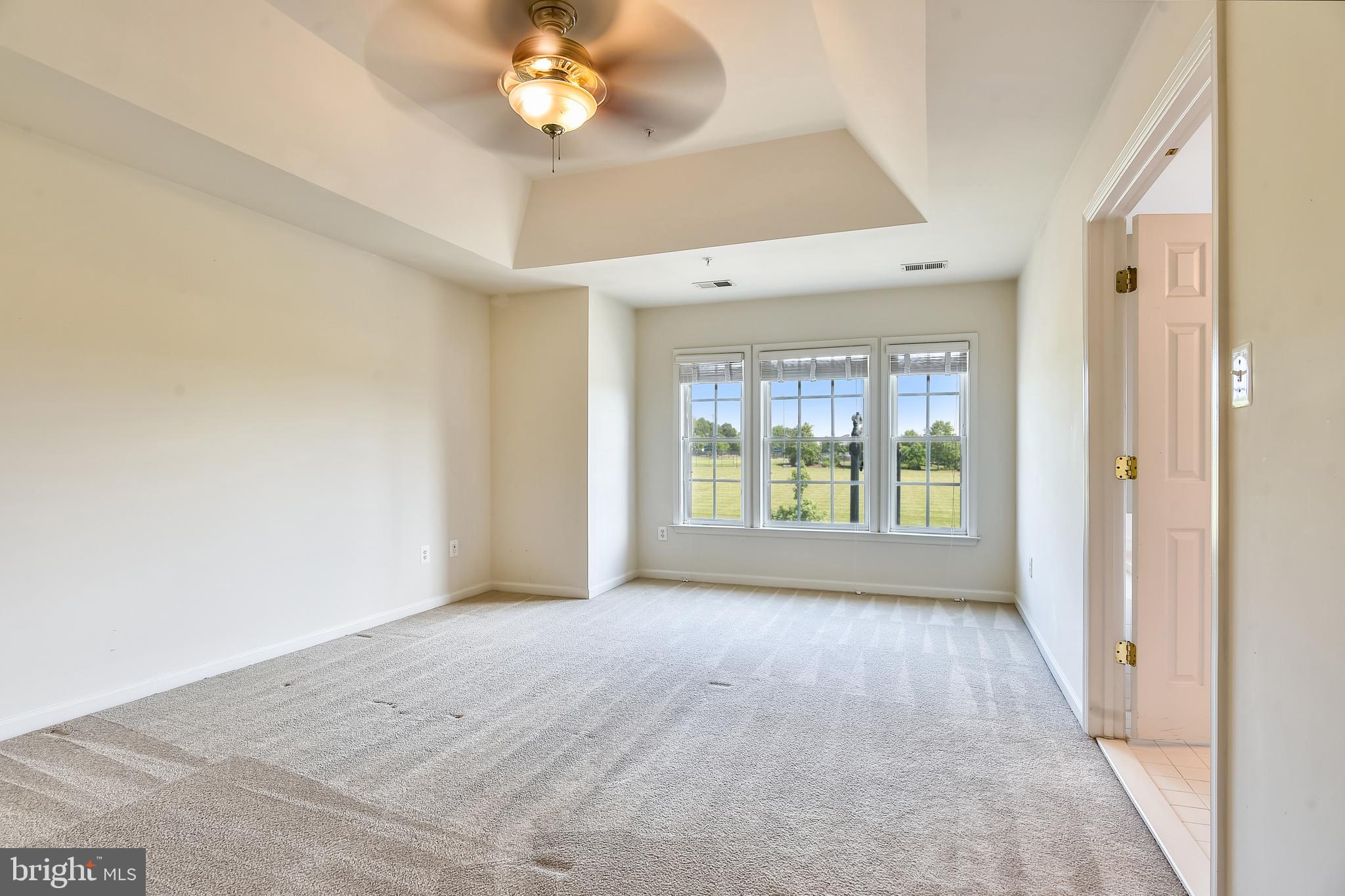 1216 Gaither Road Rockville, MD 20850 - Photo 21 of 46 Master Bedroom with Trey Ceiling and Large Windows