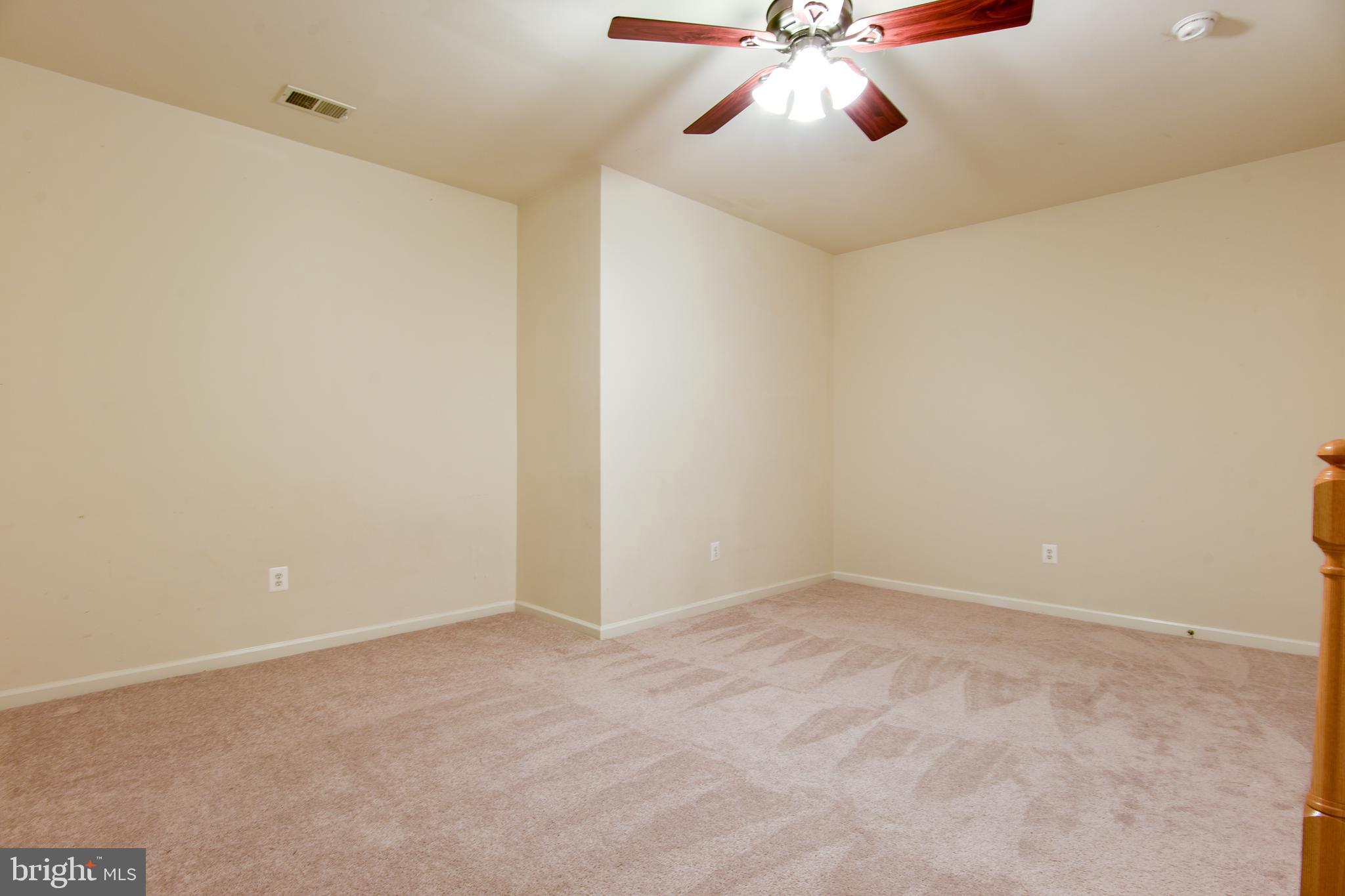 1216 Gaither Road Rockville, MD 20850 - Photo 34 of 46 Basement Recreation Room with Ceiling Fan