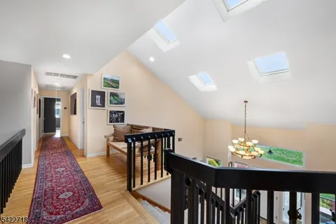 a dining room with furniture a rug and wooden floor