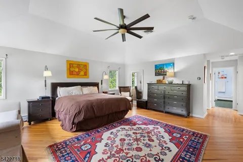 a bedroom with a bed and dresser