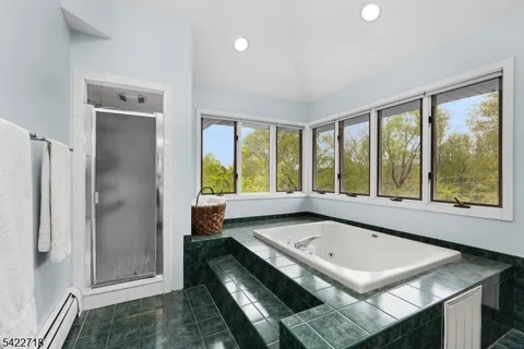 a bathroom with a tub and a sink