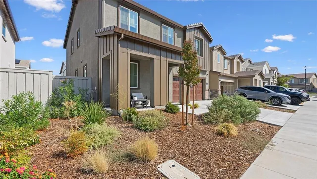 a view of a brick house many windows