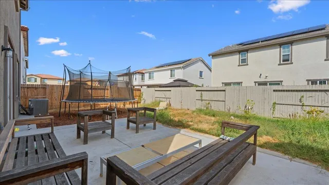 a view of a patio with couches table and chairs