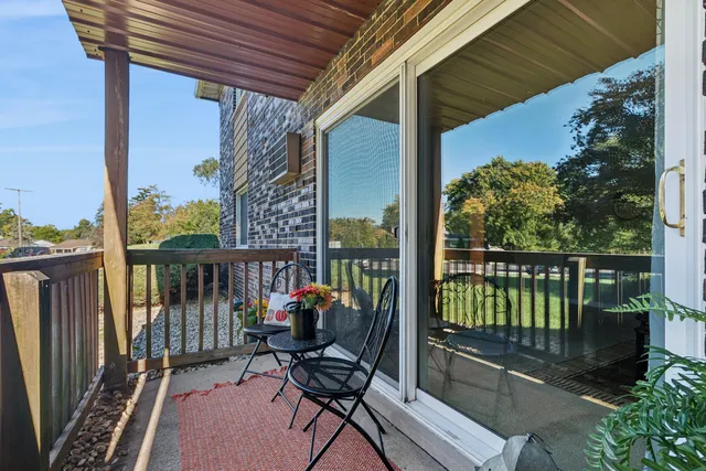 a view of a balcony with furniture