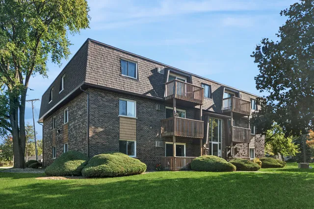a brick building with a yard