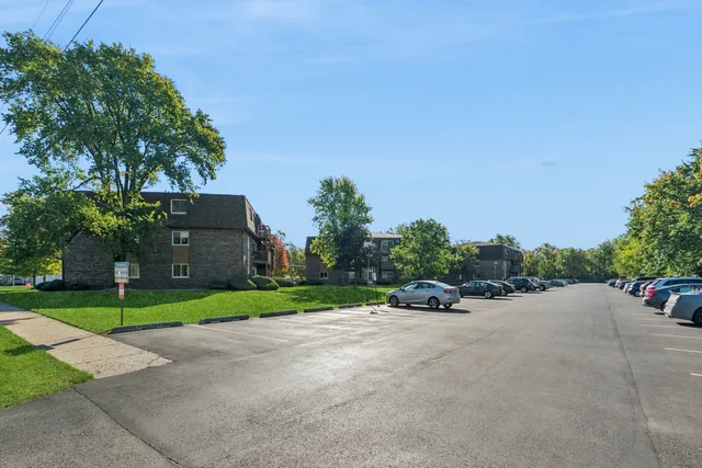 a view of a street with a house in the background
