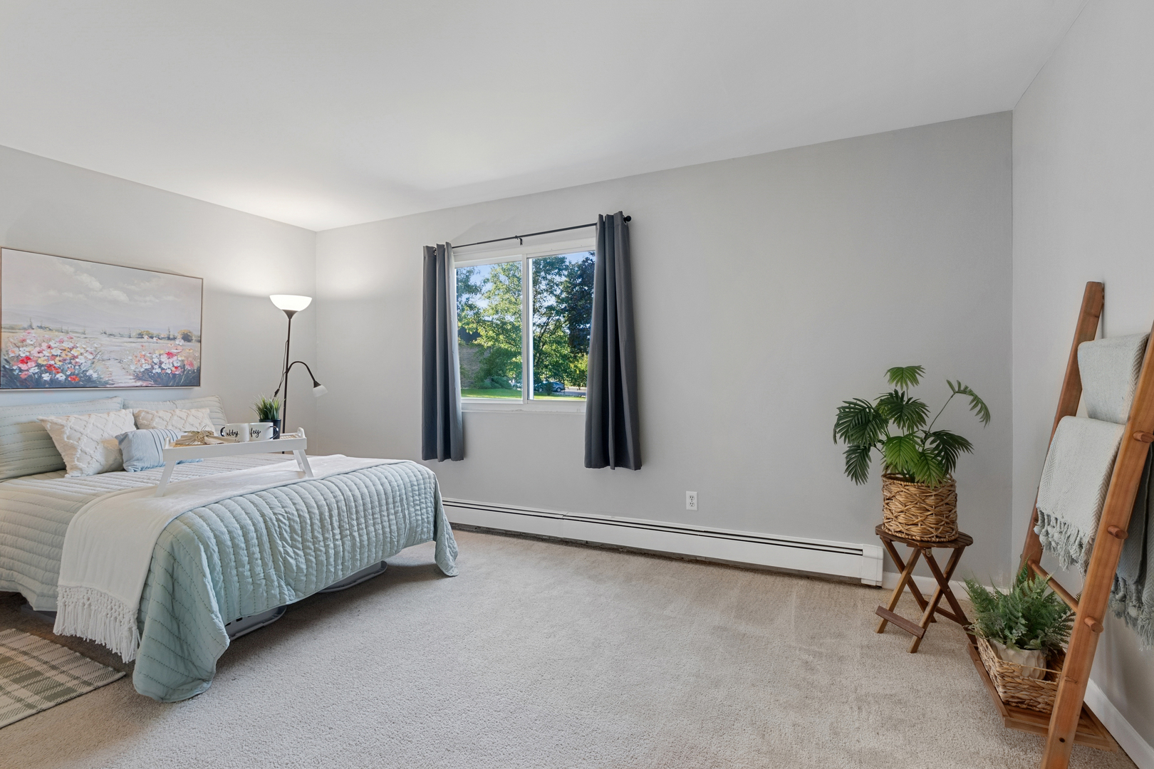19300 Wolf Road, Unit 2 Mokena, IL 60448 - Photo 8 of 17 a bedroom with a bed and a potted plant