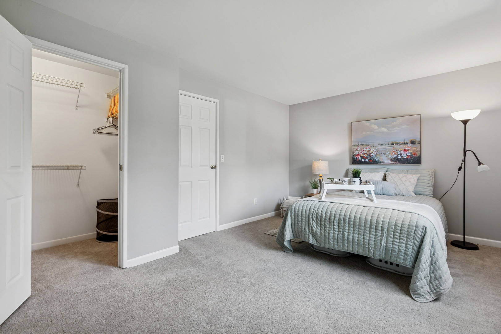 19300 Wolf Road, Unit 2 Mokena, IL 60448 - Photo 9 of 17 a bedroom with a bed and a painting on the wall