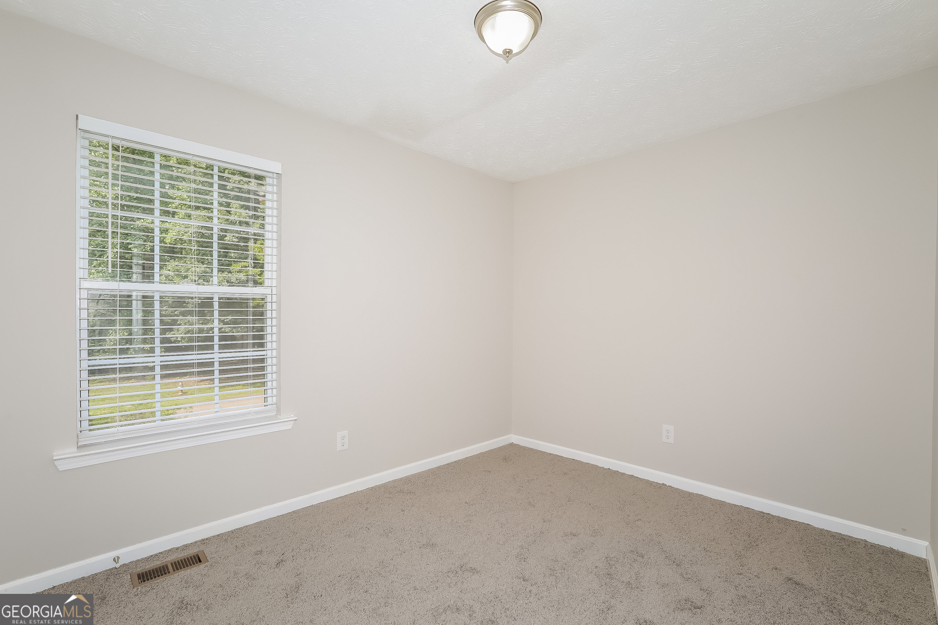 6530 River Hill Drive Flowery Branch, GA 30542 - Photo 9 of 14 a room that has a window in it