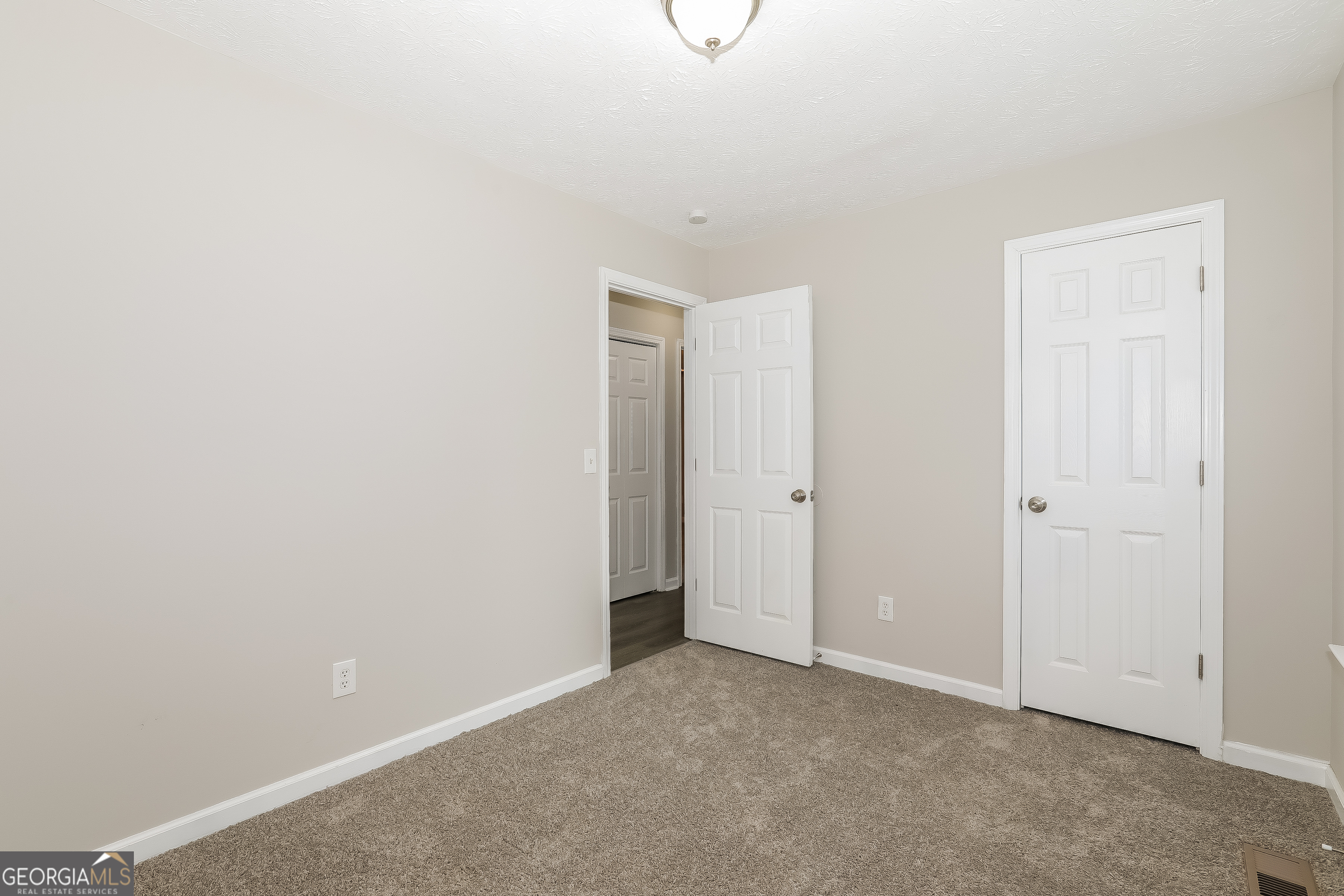 6530 River Hill Drive Flowery Branch, GA 30542 - Photo 10 of 14 a view of an empty room