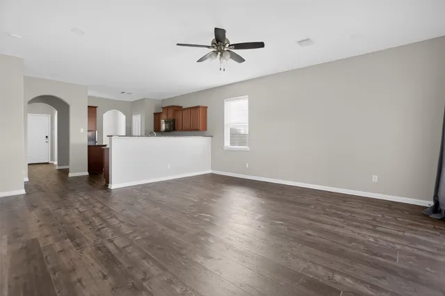 a view of a kitchen with a sink and a refrigerator