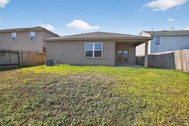 a view of a house with a yard and garage