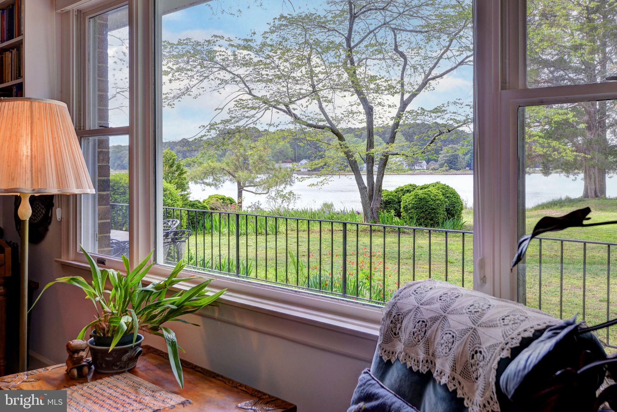 5556 Roanes Wharf Road Gloucester, VA 23061 - Photo 27 of 84 a living room filled with furniture and a potted plant