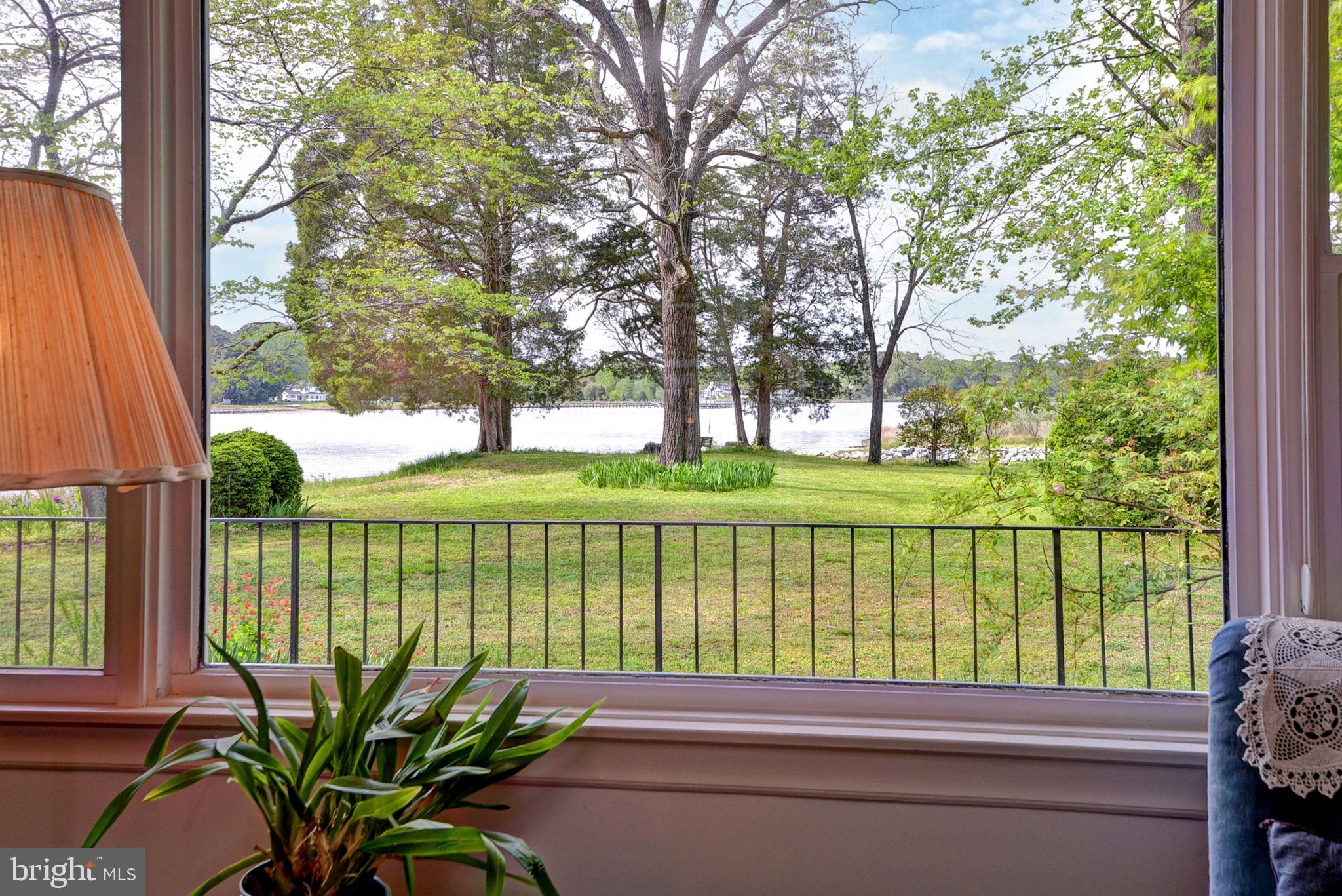 5556 Roanes Wharf Road Gloucester, VA 23061 - Photo 28 of 84 a view of a garden with a patio and a garden