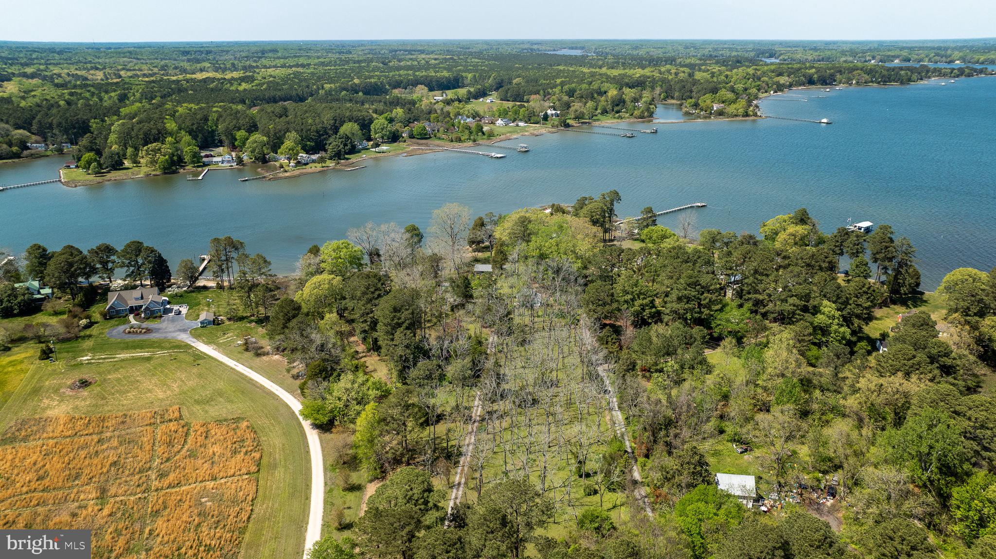 5556 Roanes Wharf Road Gloucester, VA 23061 - Photo 3 of 84 a view of a lake with a mountain view