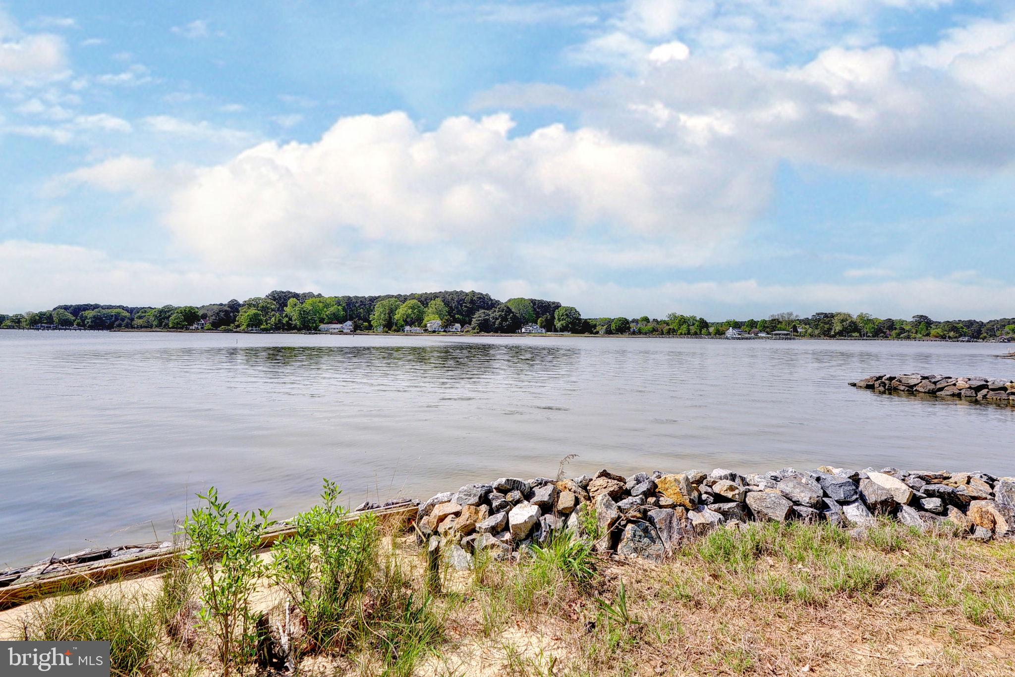5556 Roanes Wharf Road Gloucester, VA 23061 - Photo 50 of 84 a view of a lake with houses in the back