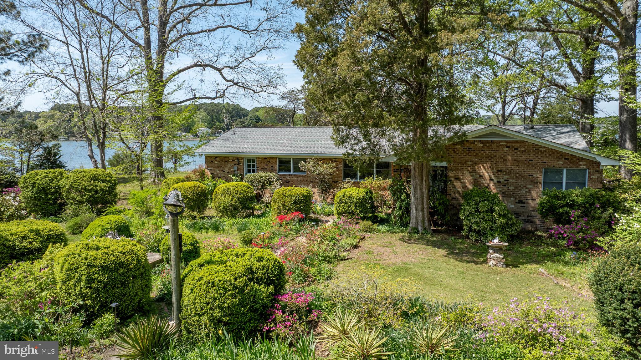 5556 Roanes Wharf Road Gloucester, VA 23061 - Photo 69 of 84 a view of a house with a yard and sitting area