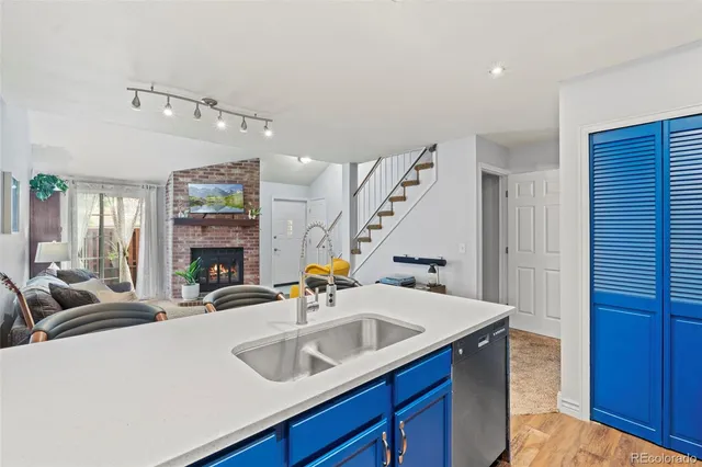 a kitchen with a sink and a refrigerator