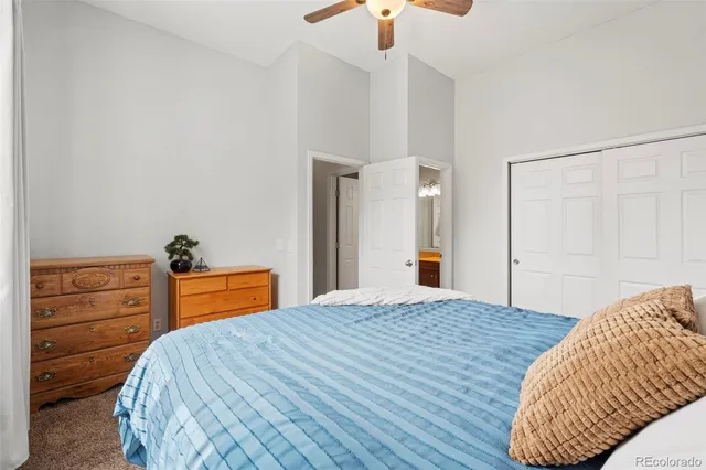 a bedroom with a bed and a dresser