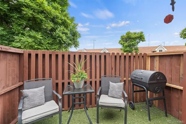 a view of a two chairs in patio