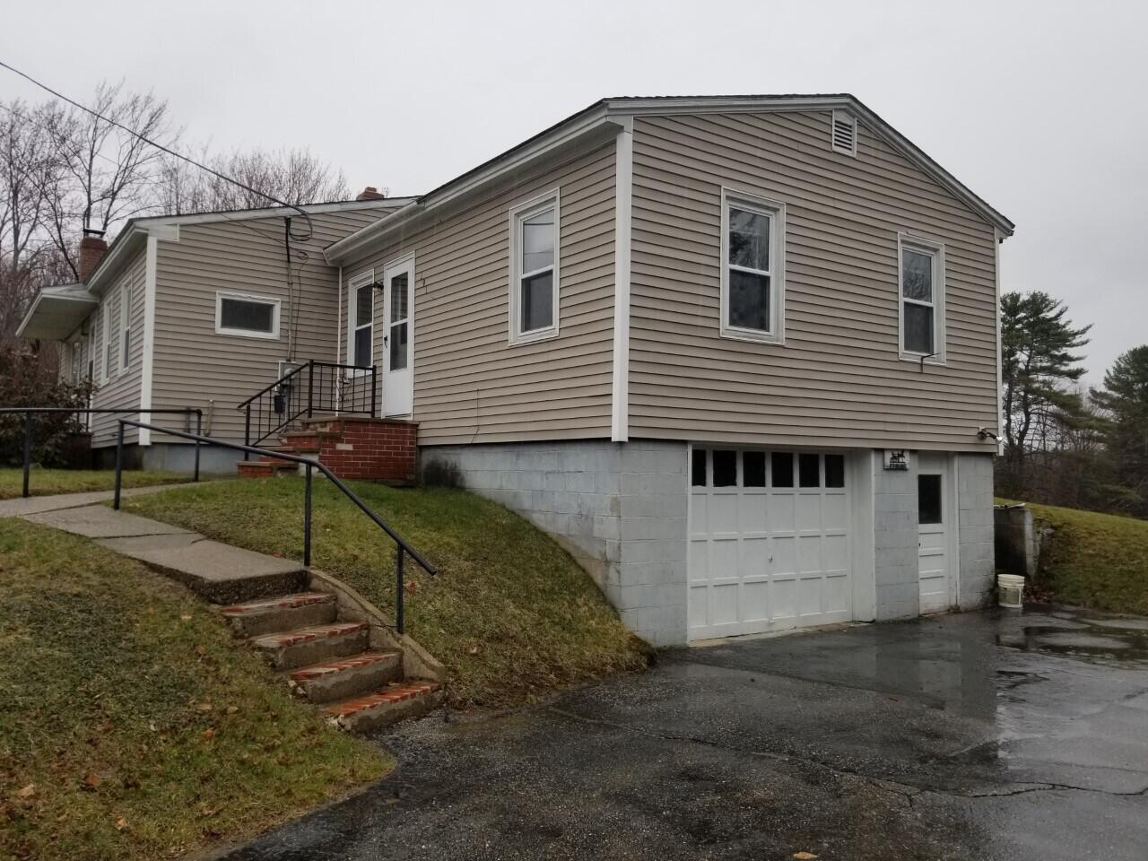 191 Weld Road Wilton, ME 04294 - Photo 2 of 32 0361 garage under spring photo