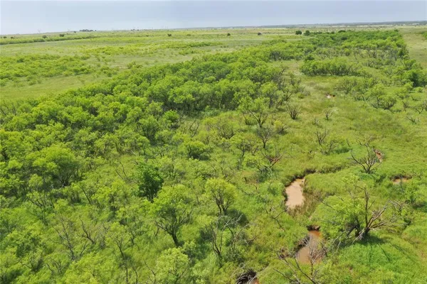 a view of a field with an outdoor space
