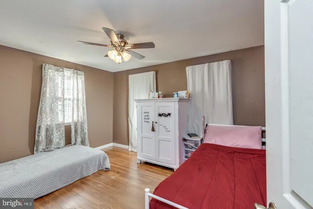 a bedroom with furniture and a window
