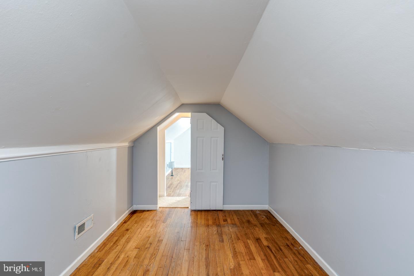 162 Oxford Road Cinnaminson, NJ 08077 - Photo 24 of 26 a view of an empty room with wooden floor and window