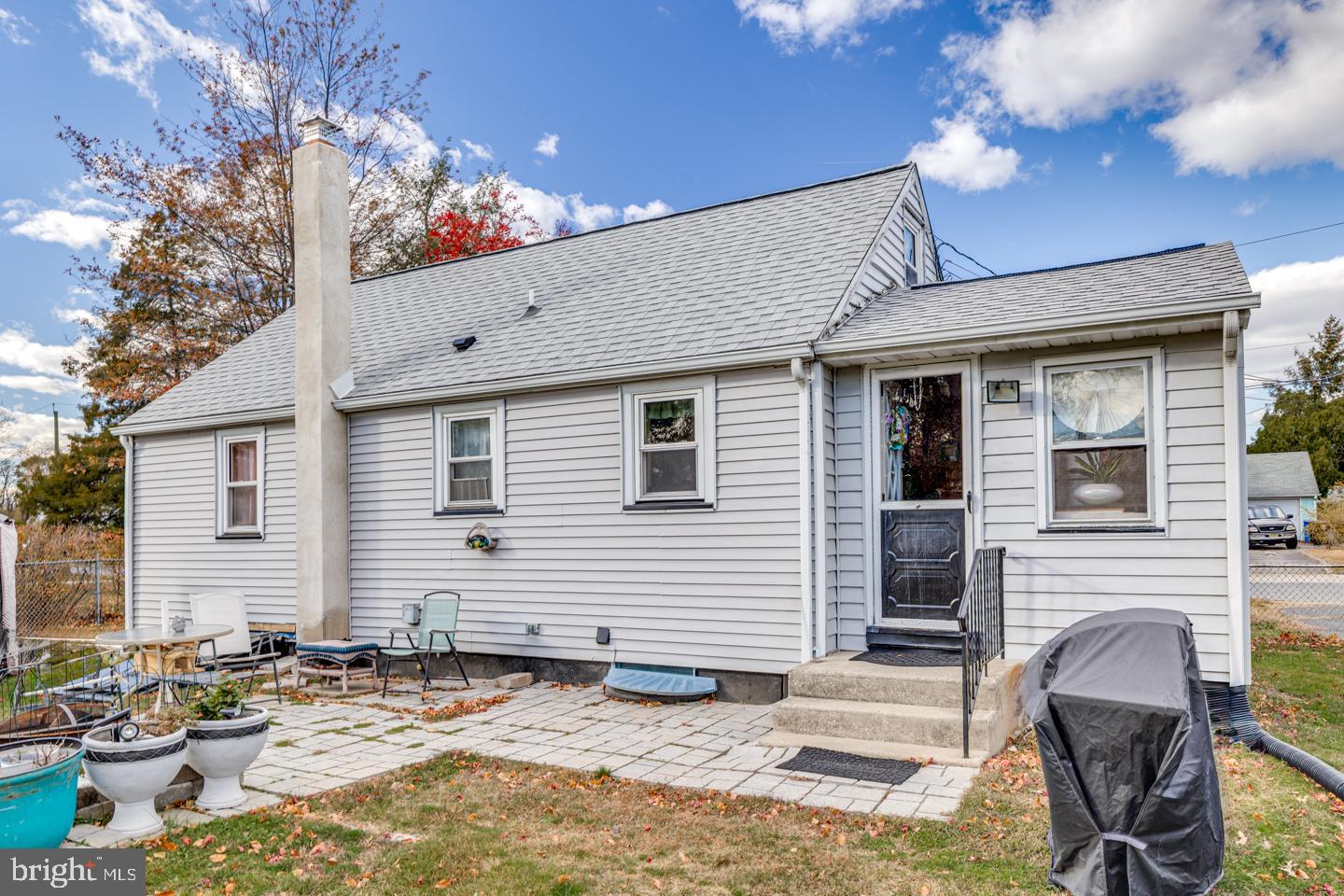 162 Oxford Road Cinnaminson, NJ 08077 - Photo 26 of 26 a backyard of a house with fire pit and chairs