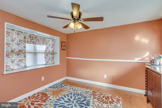 a view of room with a fan