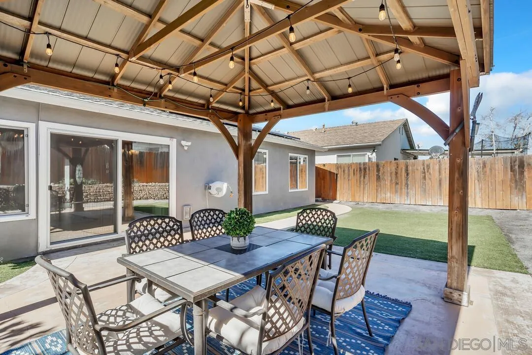 11021 Sagittarius Road San Diego, CA 92126 - Photo 12 of 28 a view of a patio with a table and chairs