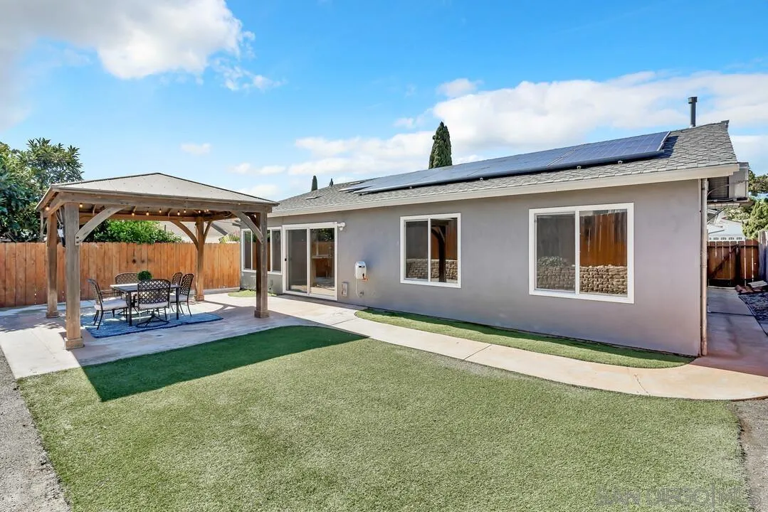 11021 Sagittarius Road San Diego, CA 92126 - Photo 14 of 28 a backyard of a house with table and chairs